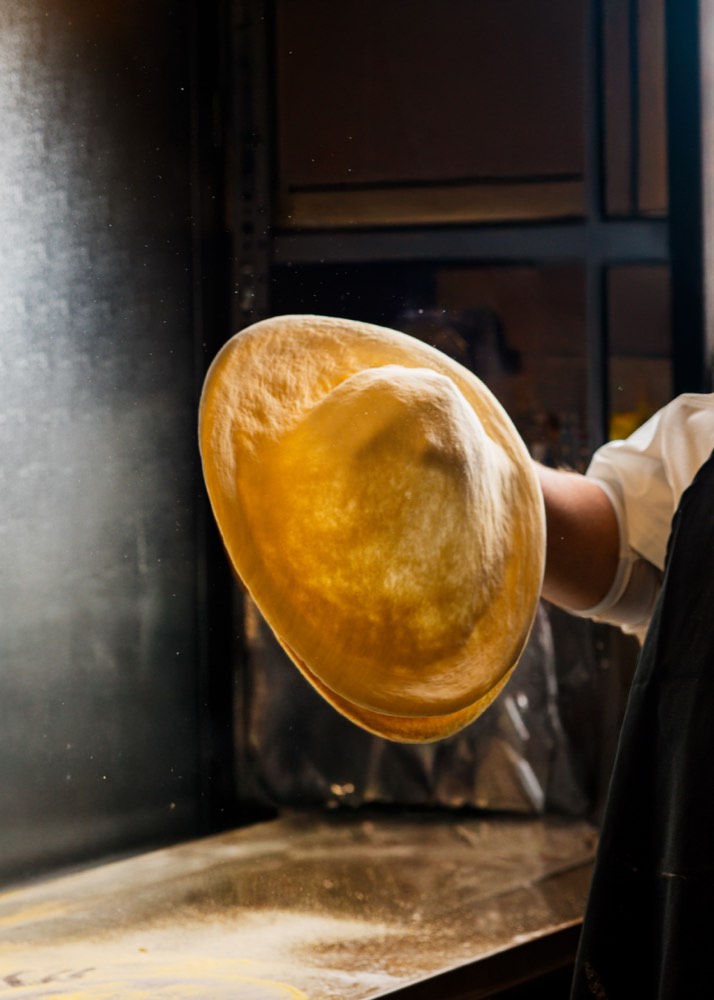 Detroit-style pizza slice pull shot for Salt & Butter delivery listings